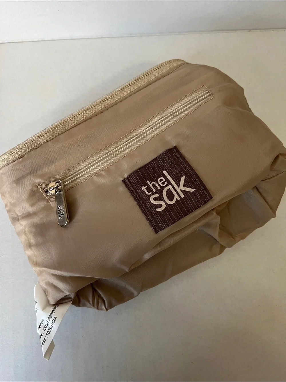 The Sak Beige and Cream Crocheted Cosmetic Pouch with Charm